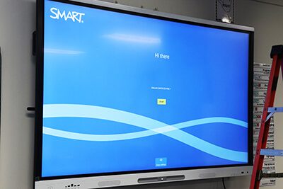 A new interactive whiteboard is installed and tested at Chesterfield Elementary