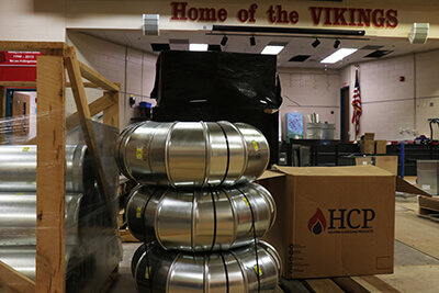 New HVAC equipment is unloaded at Uthoff Valley and readied for installation